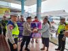 Kapolres Tolitoli Bagikan Beras Kepada Pengemudi Ojek dan Tukang Becak